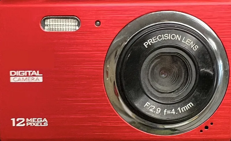Front of a red compact camera with a 12 mega pixels label beside the lens