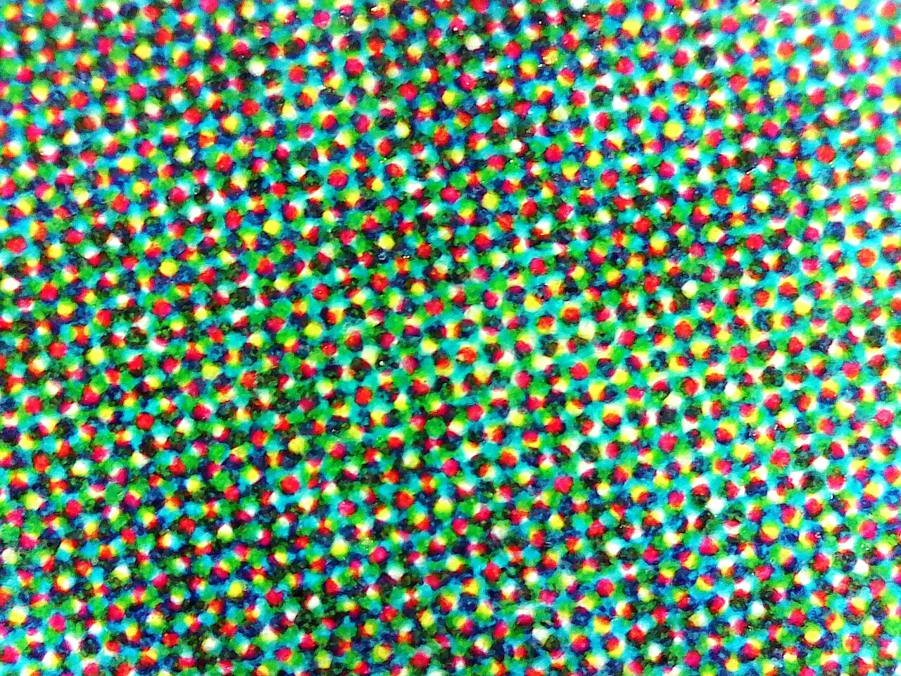 A print under heavy magnification: separate dots of ink sitting side by side
