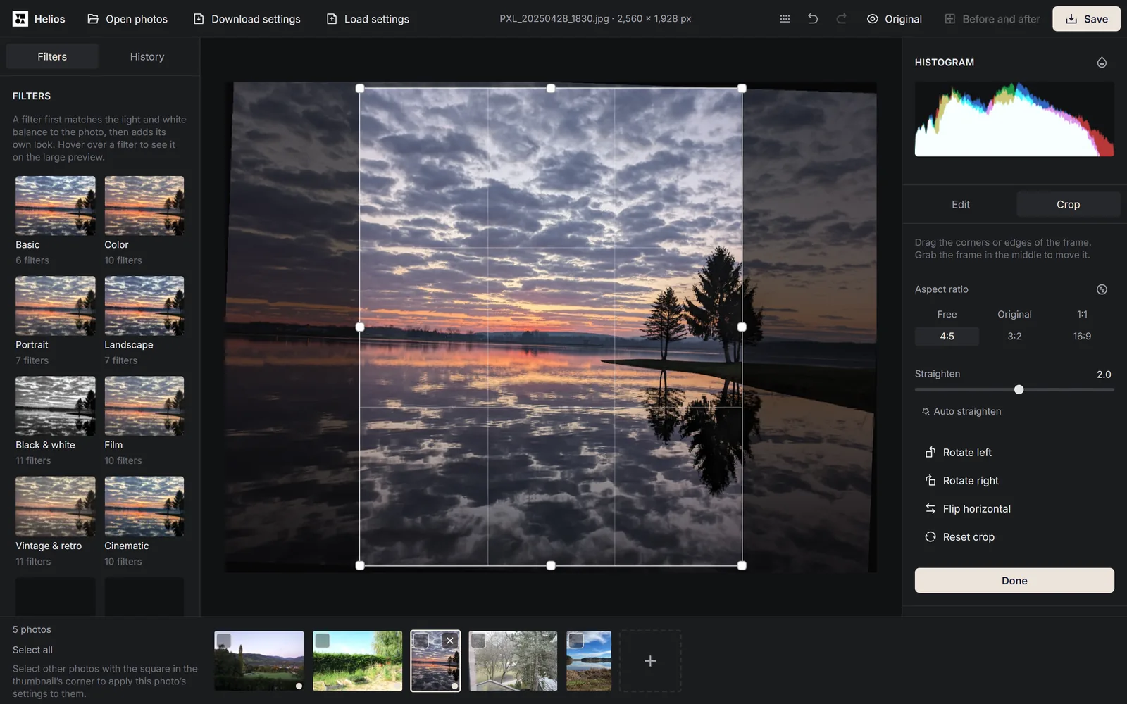 Crop mode in the Helios editor: a photo of a lake at sunset with a 4:5 crop frame, and on the right the aspect ratio buttons, the Straighten slider at 2.0 and the Done button