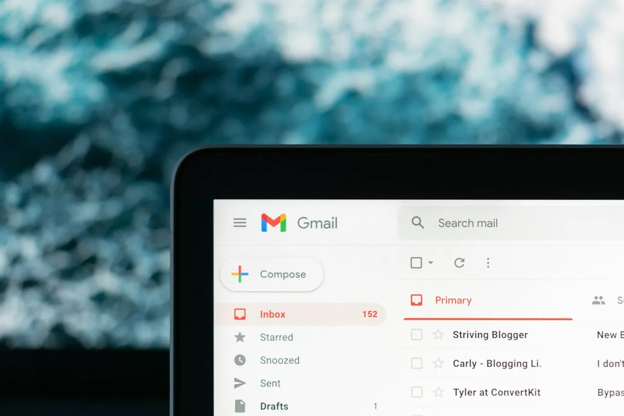 Corner of a laptop screen showing a Gmail inbox with 152 messages in the Inbox folder